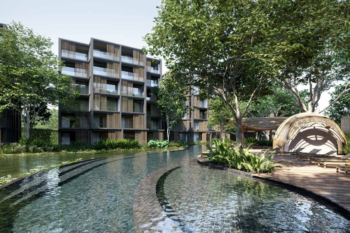 Mont Azure Branded Residences in Phuket, featuring modern beachfront architecture surrounded by lush greenery and ocean views.