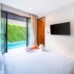 24-Bedroom Boutique Villa & Hotel Resort in Thalang, Phuket bedroom with tv and pool accesss PSR-THA-642