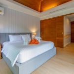 24-Bedroom Boutique Villa & Hotel Resort in Thalang, Phuket bedroom with blue upholstered bed PSR-THA-642