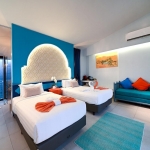 24-Bedroom Boutique Villa & Hotel Resort in Thalang, Phuket twin bedroom with turquoise blue headboard and rug PSR-THA-642