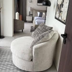 3-bedroom sea view pool villa near Layan Beach, Phuket armchair and footstool with bedroom in the background PSV-LAY-632