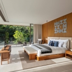 3-4 bedroom pool villas in the 5-Star Layan Bay area, Phuket bedroom with wood panels and balcony access PSV-LAY-1041