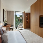 3-4 bedroom pool villas in the 5-Star Layan Bay area, Phuket bedroom with working table and white armchair PSV-LAY-1041