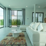 3–4 bedroom pool villa with large pool in Rawai, Phuket living area with white couch PSV-RAW-1099