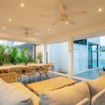 4 bedroom Scandinavian pool villa for sale in Cherng Talay, Phuket – poolside sala with dining and lounging furniture