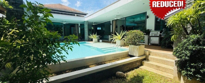 2-bedroom pool villa in Soi Samakki, Rawai, Phuket exterior shot showing pool and garden with price reduced stamp PSV-RAW-1422