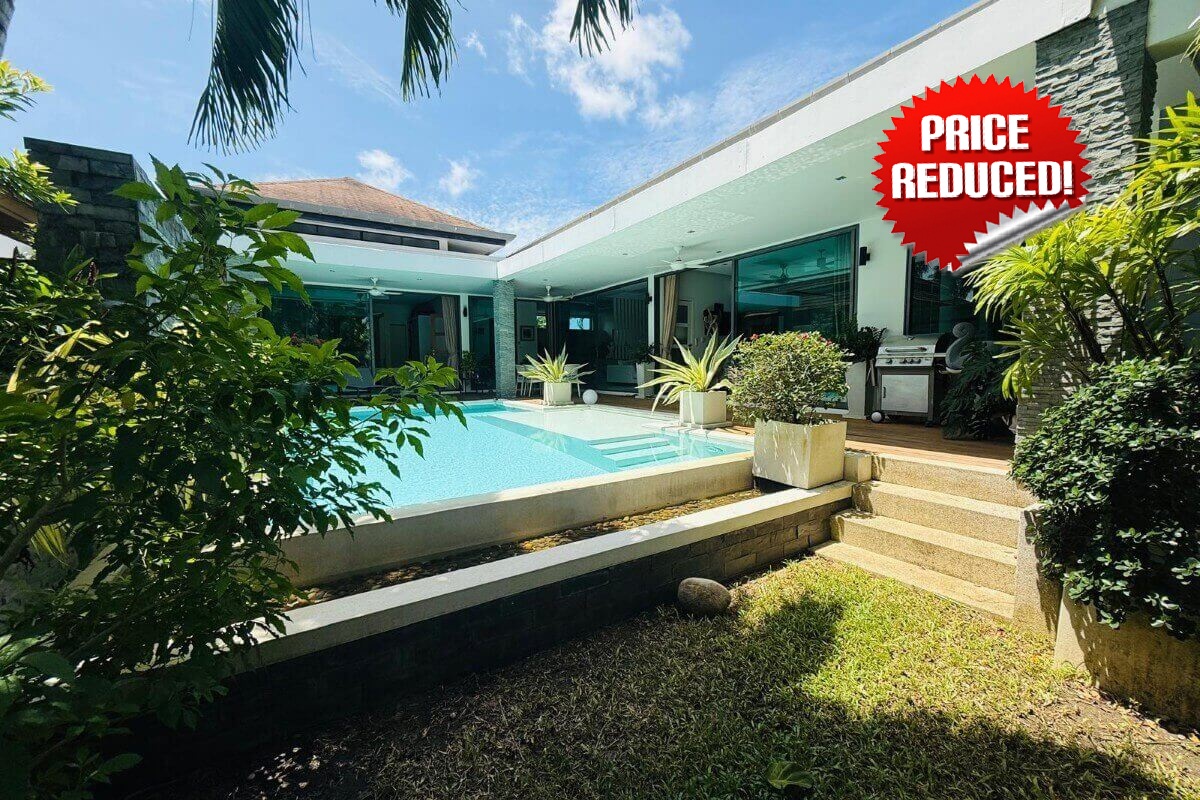 2-bedroom pool villa in Soi Samakki, Rawai, Phuket exterior shot showing pool and garden with price reduced stamp PSV-RAW-1422