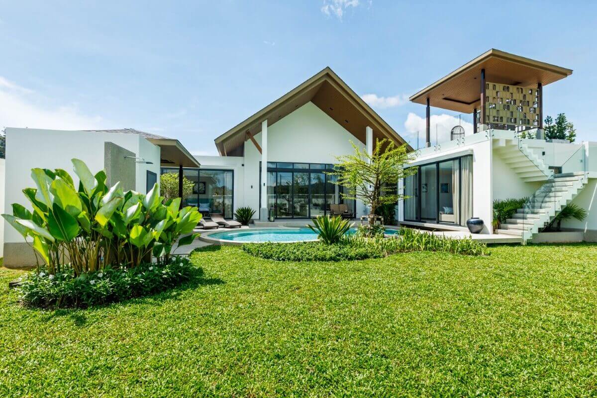3-bedroom pool villa for sale in Pru Jampa near UWC Phuket exterior shot including garden and pool PSV-PRJ-1429