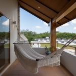 4-bedroom pool villas in Baan Manik, Phuket balcony with white hammock PSV-MNK-1267