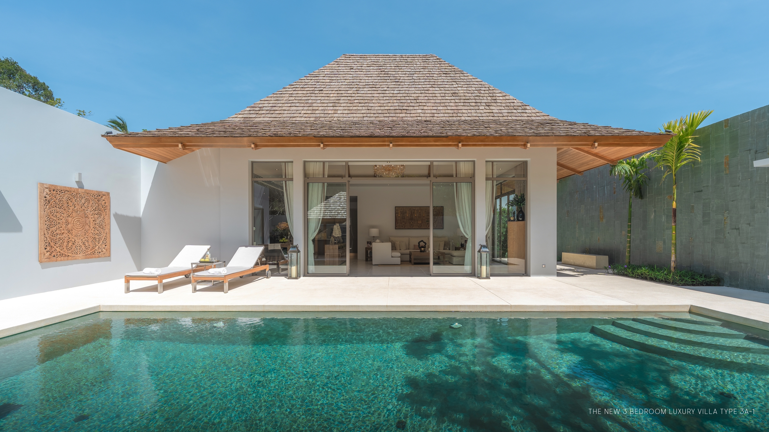 Spacious open-plan living area with vaulted ceiling at Anchan Villas Phuket