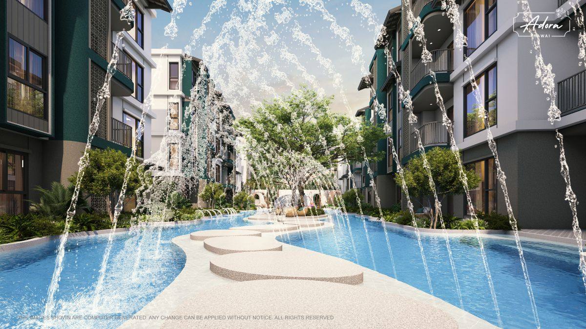 Resort-style swimming pool surrounded by tropical landscaping at Adora