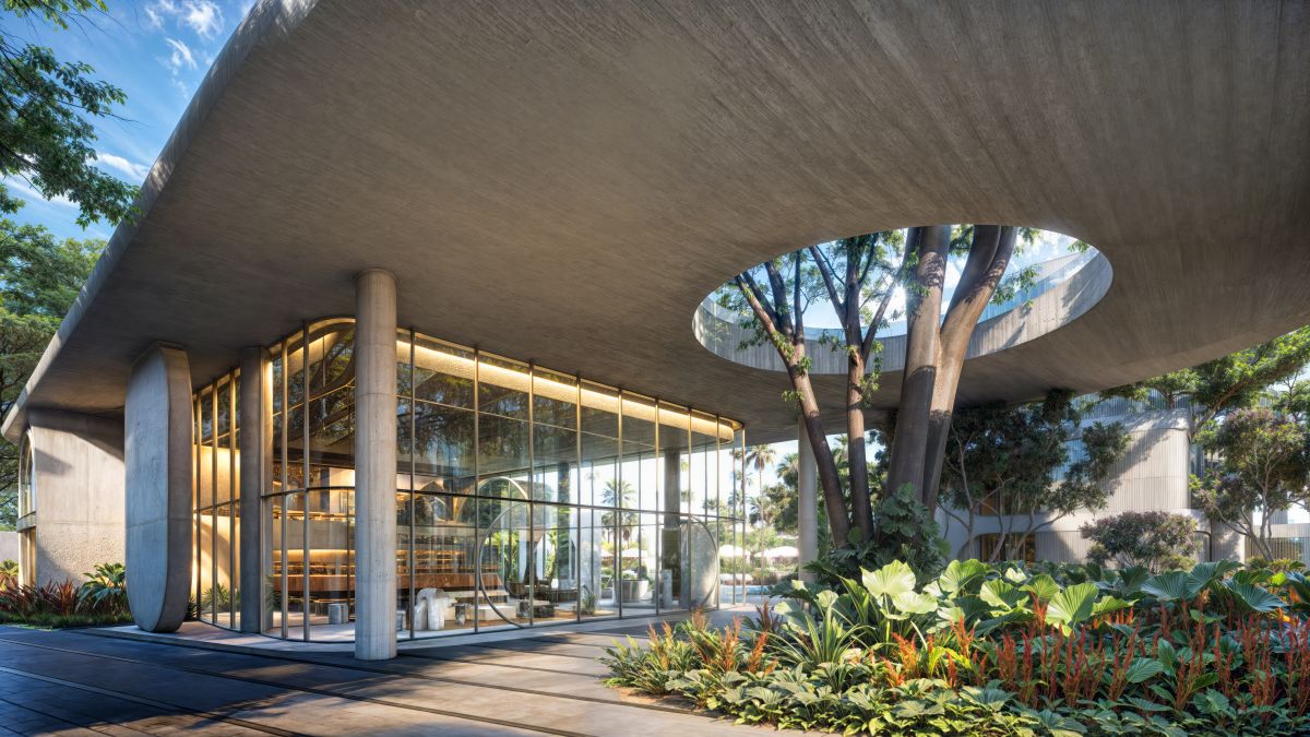Stylish lobby and outdoor lounge at The Standard Residences Phuket featuring modern design, natural wood accents, and open-air seating surrounded by tropical greenery near Bang Tao Beach.