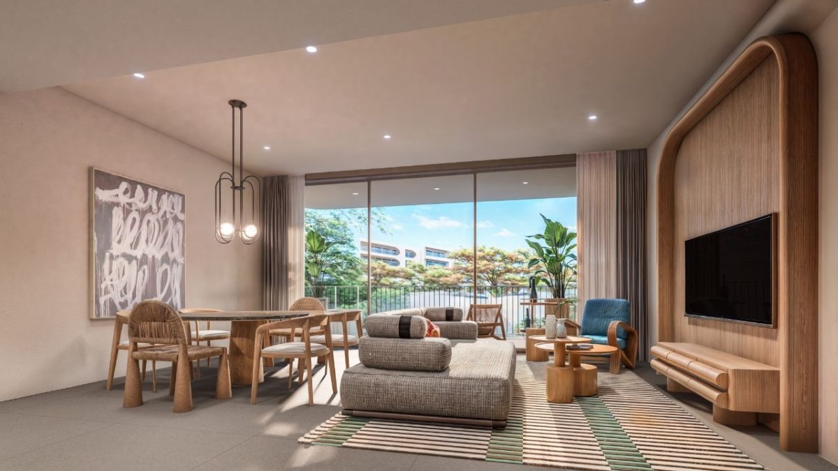 Contemporary 2-bedroom unit at The Standard Residences Phuket featuring open-plan living, modern furnishings, floor-to-ceiling windows, and a private balcony near Bang Tao Beach.
