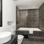 4-bedroom hillside sea view pool villa Surin Beach, Phuket bathroom with gray tiles and bathtub PSV-SUR-800