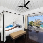 4-bedroom hillside sea view pool villa Surin Beach, Phuket 4-poster bed, dark wood floors and white vaulted ceiling and balcony PSV-SUR-800