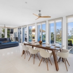 4-bedroom hillside sea view pool villa Surin Beach, Phuket open plan 8-seater dining and living area with glass doors to pool terrace PSV-SUR-800