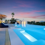 2-bedroom condos with private pools near Chalong Bay and ISP in Rawai Phuket view of rooftop pool evening PSC-RAW-1492