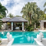 4-bedroom pool villa on a large plot in Rawai, Phuket pool and palm trees PSV-RAW-1520