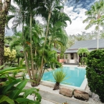 4-bedroom pool villa on a large plot in Rawai, Phuket pool surrounded by tropical plants PSV-RAW-1520