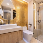 1–2 bedroom condos for sale near Kata Beach, Phuket bathroom with gold colored tiles PSC-KAT-1547
