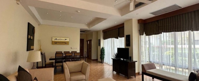 3-bedroom golf course view pool villa in Laguna, Phuket dining and kitchen area with floor to ceiling sliding glass doors PSV-LAG-1549