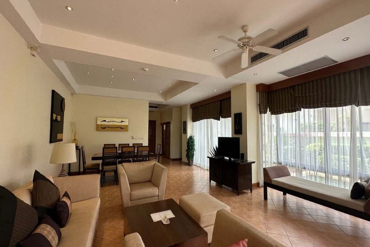 3-bedroom golf course view pool villa in Laguna, Phuket dining and kitchen area with floor to ceiling sliding glass doors PSV-LAG-1549