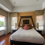 3-bedroom golf course view pool villa in Laguna, Phuket bedroom with Thai headboard and lots of windows PSV-LAG-1549