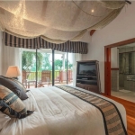 4-bedroom golf course view pool villa in Laguna, Phuket bedroom with terrace with outdoor wooden furniture PSV-LAG-1548