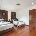 4-bedroom golf course view pool villa in Laguna, Phuket bedroom with twin beds and wooden floors PSV-LAG-1548