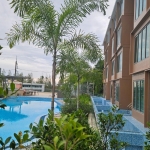 Studio condo near Kamala Beach, Phuket pool surrounded by tropical plants PSC-KAM-1544 exterior view