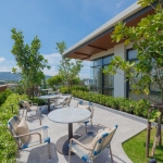 1-2 bedroom condos & penthouses in the Laguna Area, Phuket outdoor terrace with tropical plants and seating areas PSC-CHE-1560