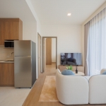 1-2 bedroom condos & penthouses in the Laguna Area, Phuket living area and kitchen PSC-CHE-1560