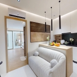 1-2 bedroom condos for sale near Porto de Phuket in Cherng Talay 2-seater couch and kitchen PSC-CHE-1578