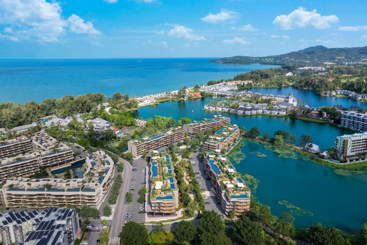 1-3 bedroom condos for sale in Laguna, Phuket aerial view of lakeside development with ocean background PSC-LAG-1568