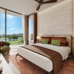 2–3 bedroom condos & penthouses in Laguna, Phuket bedroom with olive green armchair and golf course views PSC-LAG-1566