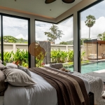 3-4 bedroom pool villas in Soi Naya near Nai Harn Beach, Phuket bedroom with floor to ceiling glass walls and doors and pool access PSV-NAH-1569