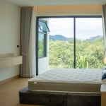 3-bedroom modern pool villa near Lotus’s in Chalong, Phuket bedroom with large glass wall and mountain view PSV-CHA-1579