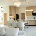 3-bedroom modern pool villa near Lotus’s in Chalong, Phuket dining table, kitchen and stair to upper floor PSV-CHA-1579