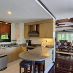 3-bedroom pool villa near Kata Beach, Phuket kitchen and living area to the rear PSV-KAT-1553