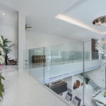 5-bedroom pool villa near Nai Harn Beach in Rawai, Phuket upper floor landing and hallway overlooking dining and living room PSV-NAH-1577