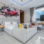 5-bedroom pool villa near Nai Harn Beach in Rawai, Phuket bedroom with pokemon on bench bed and poster of red car PSV-NAH-1577