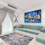 6-bedroom beachfront pool villa on Natai Beach, tv room with L-shaped blue couch PSV-PHA-1565