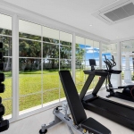 6-bedroom beachfront pool villa on Natai Beach, gym with white french windows and beach view PSV-PHA-1565