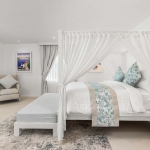 6-bedroom beachfront pool villa on Natai Beach, white bedroom with 4-poster bed and window to ensuite PSV-PHA-1565