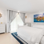 6-bedroom beachfront pool villa on Natai Beach, white bedroom with twin bed and chest cabinet PSV-PHA-1565