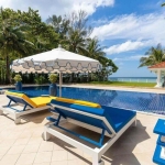 6-bedroom beachfront pool villa on Natai Beach, poolside sun loungers facing the beach PSV-PHA-1565