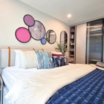 1-2 bedroom & plus condos adjacent to HomePro in Cherng Talay, Phuket bedroom with purple bed runner PSC-CHE-1599