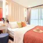 1-2 bedroom & plus condos adjacent to HomePro in Cherng Talay, Phuket bedroom with orange bed runner PSC-CHE-1599