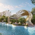 1-bedroom condos near Kamala Beach, Phuket aerial lagoon pool with buildings in the background PSC-KAM-1592