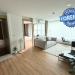 1-bedroom condo for sale 400m to Kalim Beach, Phuket living area and doors to bathroom and bedroom PSC-KAL-1591